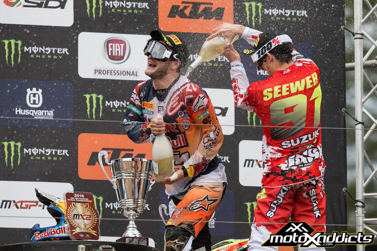 Jeremy Seewer (right) gives Jeffrey Herlings (left) a champagne shower in Latvia.